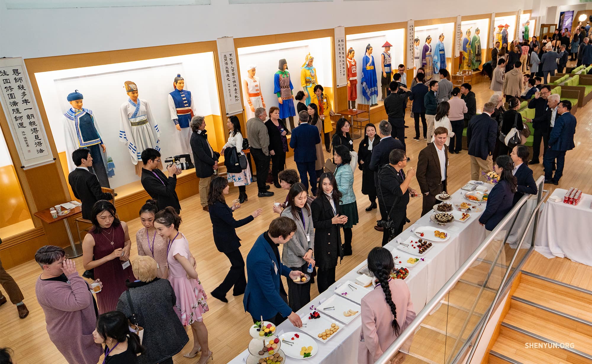 Shen Yun artists mingle with attendees at the screening of “Unbroken” at Dragon Springs, home of Shen Yun Performing Arts.
